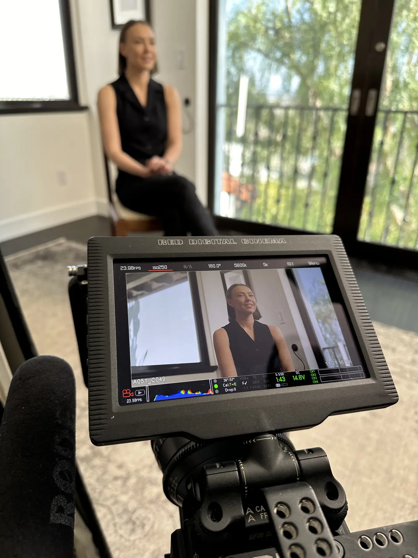 A production monitor frames Victoria Myssik during her Los Angeles interview